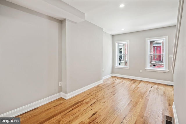 spare room featuring light hardwood / wood-style flooring