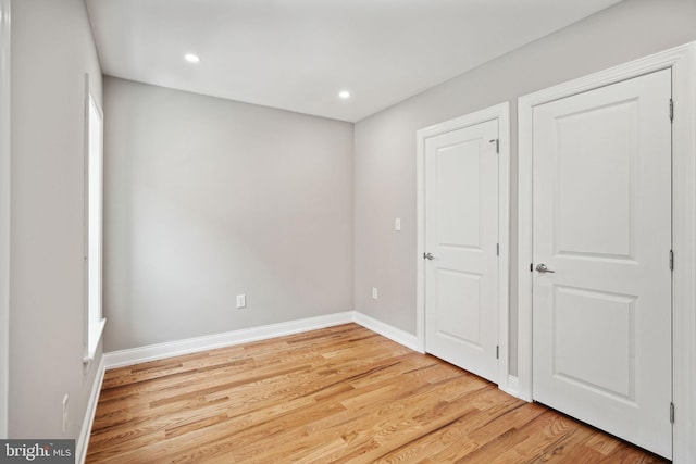 unfurnished bedroom with light hardwood / wood-style floors