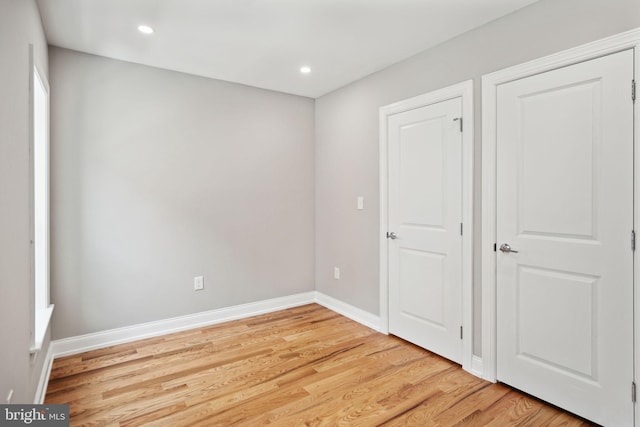 unfurnished bedroom featuring light wood-type flooring