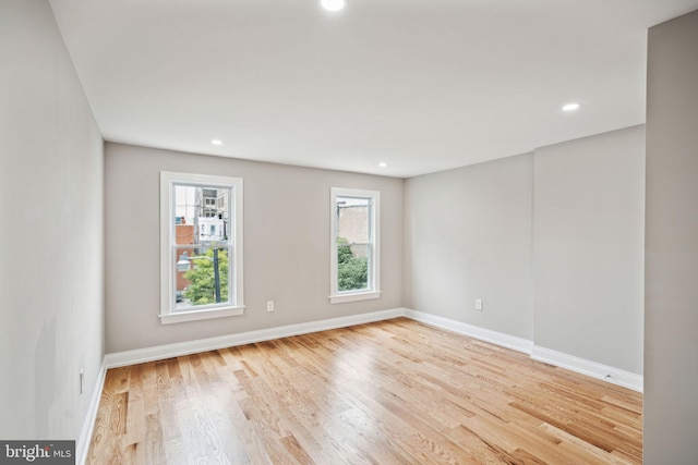 unfurnished room featuring light hardwood / wood-style flooring