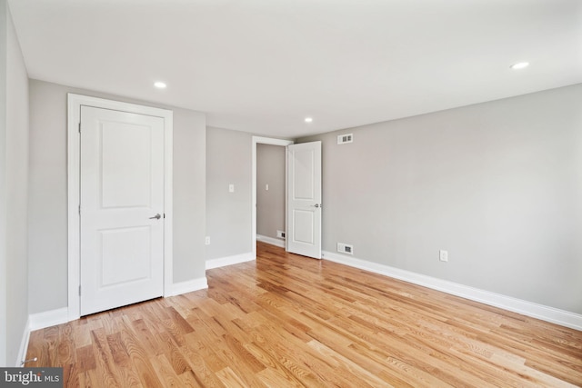 spare room with light wood-type flooring