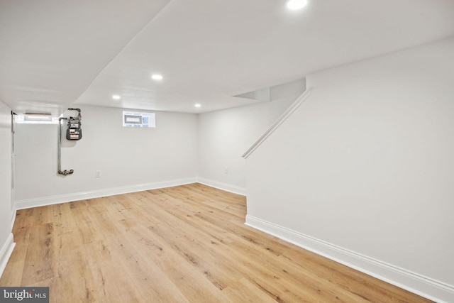 basement featuring light wood-type flooring