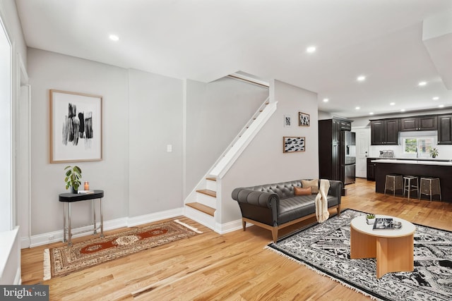 living room with light hardwood / wood-style flooring