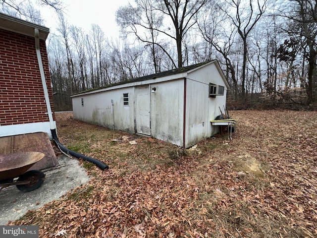 view of outbuilding with a wall mounted AC