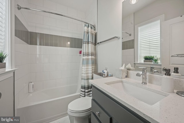 full bathroom featuring toilet, vanity, and shower / tub combo with curtain