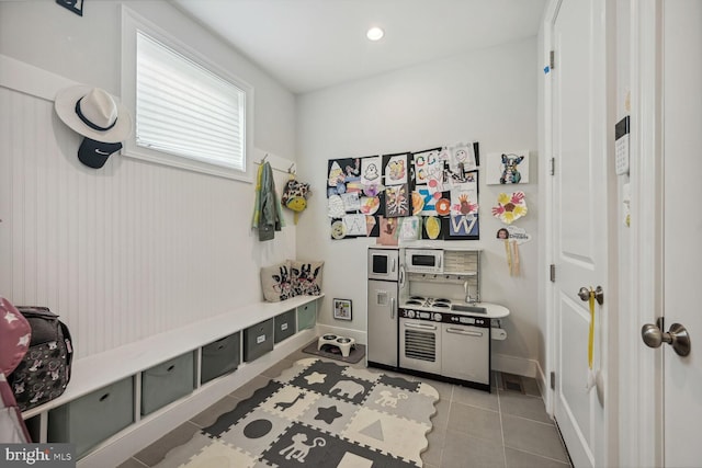 mudroom with light tile patterned flooring