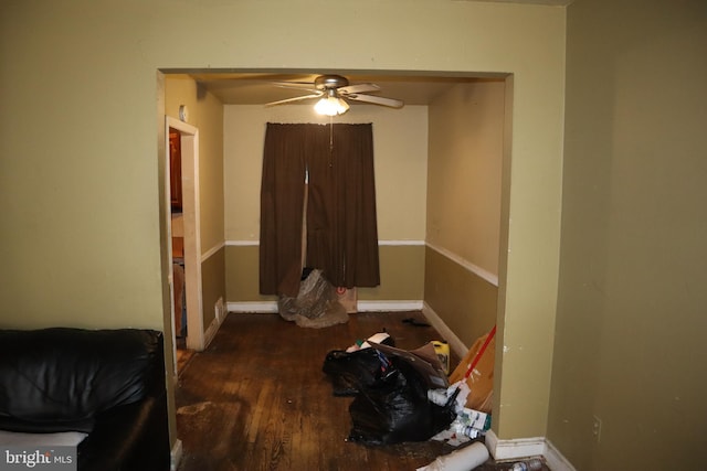 bedroom featuring wood finished floors and baseboards