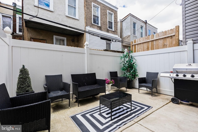 view of patio with outdoor lounge area and area for grilling