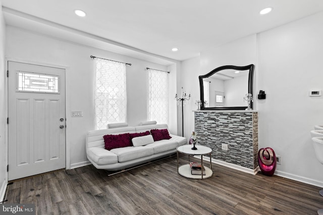 living room with dark hardwood / wood-style flooring