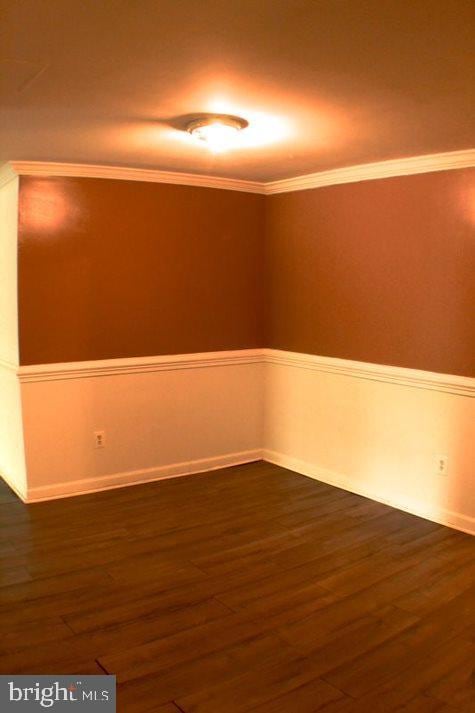 empty room with dark hardwood / wood-style floors