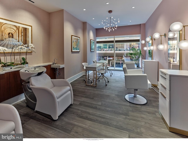 living room featuring a chandelier, dark hardwood / wood-style flooring, and sink