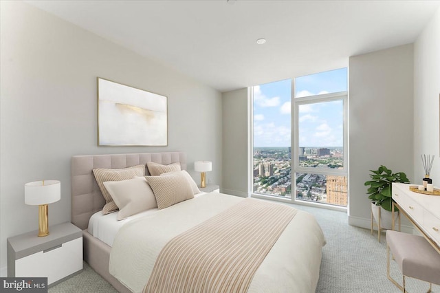 bedroom featuring light carpet and expansive windows