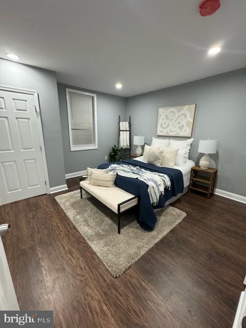 bedroom featuring dark wood-type flooring