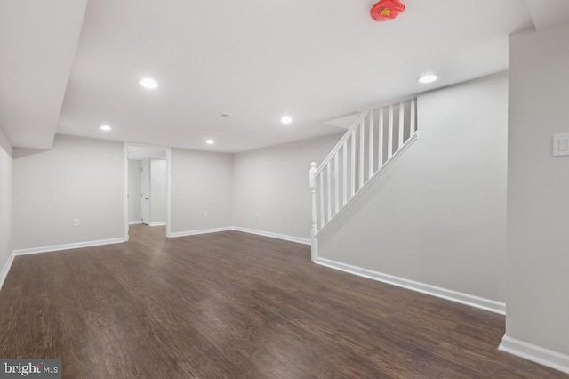 basement with dark wood-type flooring