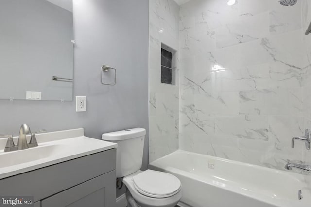 full bathroom with vanity, toilet, and tiled shower / bath