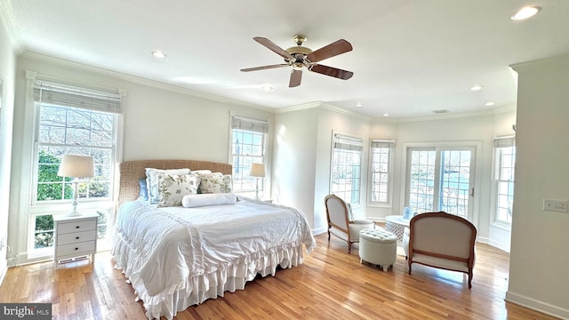 bedroom featuring ceiling fan, crown molding, and light wood-type flooring