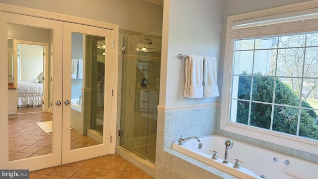 bathroom featuring french doors, tile patterned floors, and shower with separate bathtub