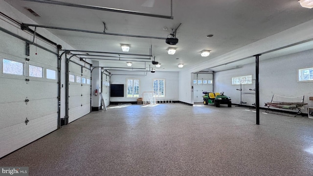 garage featuring a garage door opener