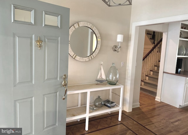 foyer with dark hardwood / wood-style floors