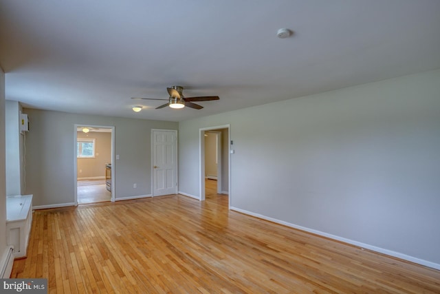 spare room with ceiling fan and light hardwood / wood-style floors