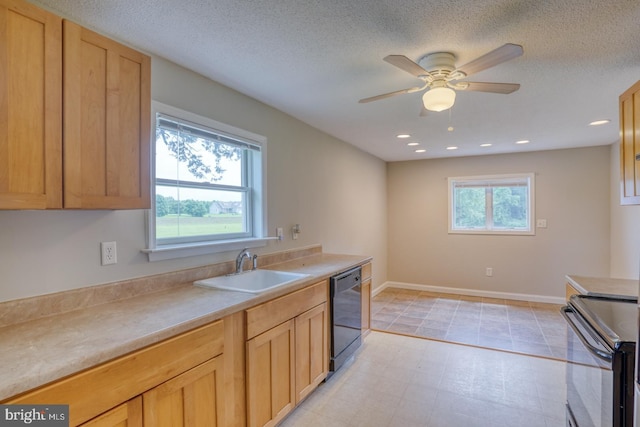 kitchen featuring plenty of natural light, sink, black dishwasher, and range with electric stovetop