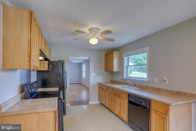 kitchen featuring dishwasher, sink, electric range oven, and light brown cabinets