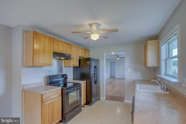 kitchen with light brown cabinetry, sink, black appliances, and ceiling fan