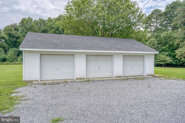 garage featuring a yard