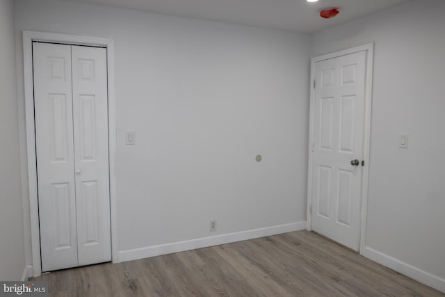 unfurnished bedroom with light hardwood / wood-style flooring