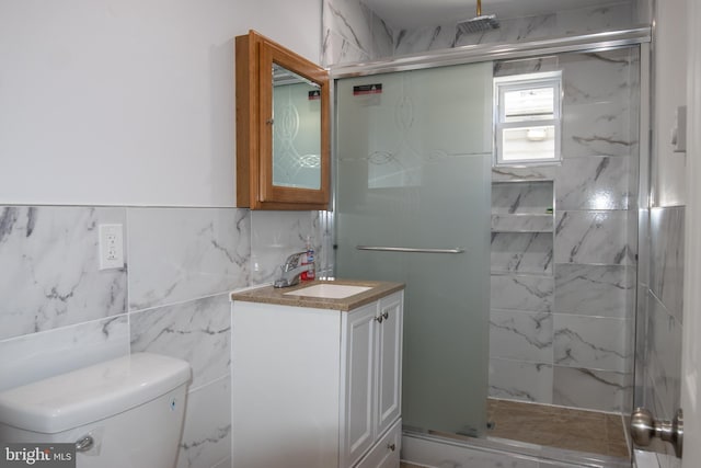 bathroom featuring toilet, an enclosed shower, and vanity