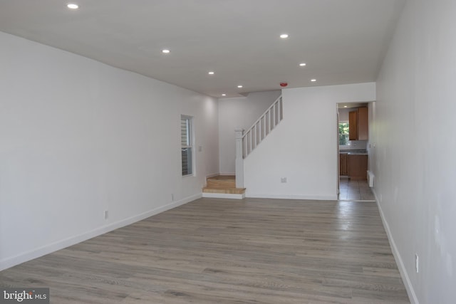 unfurnished living room with light hardwood / wood-style flooring