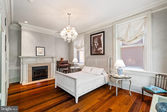 bedroom with a fireplace, dark hardwood / wood-style floors, and ornamental molding