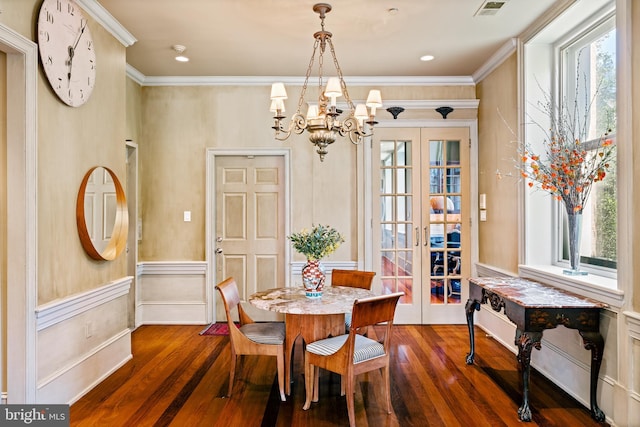 dining space with french doors, dark wood-type flooring, and plenty of natural light