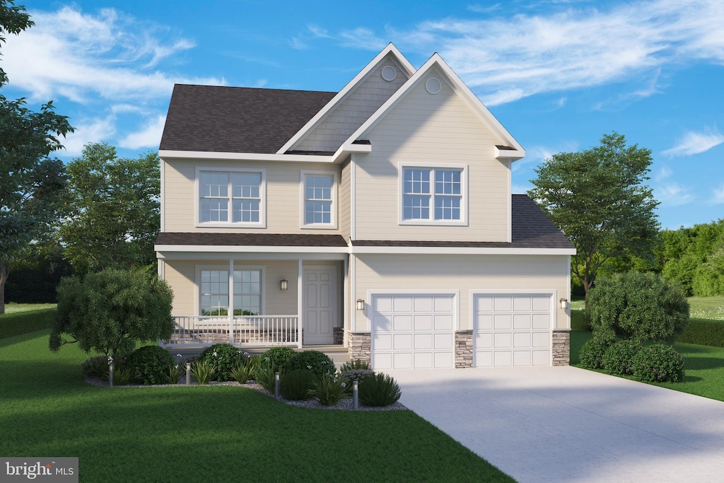 view of front of property featuring covered porch, a garage, and a front yard