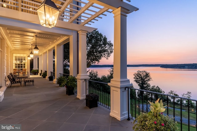 patio terrace at dusk with a water view