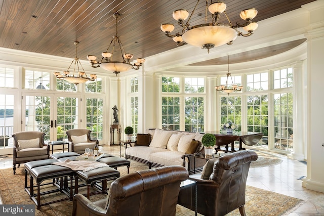 sunroom with wooden ceiling, french doors, decorative columns, and a healthy amount of sunlight