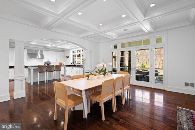 dining space with beamed ceiling, ornate columns, and coffered ceiling