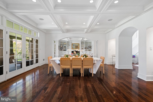 dining area with beamed ceiling, dark hardwood / wood-style floors, coffered ceiling, and french doors