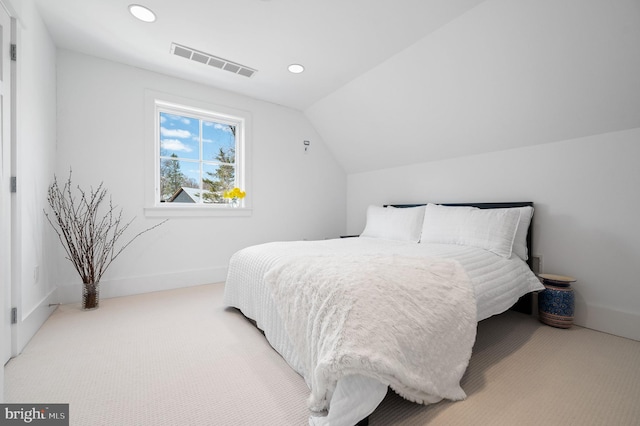 carpeted bedroom featuring vaulted ceiling