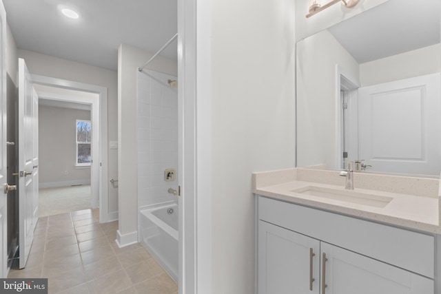 bathroom featuring tile patterned floors, vanity, and tiled shower / bath combo