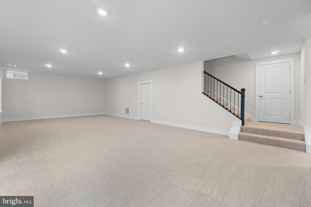 interior space featuring light colored carpet