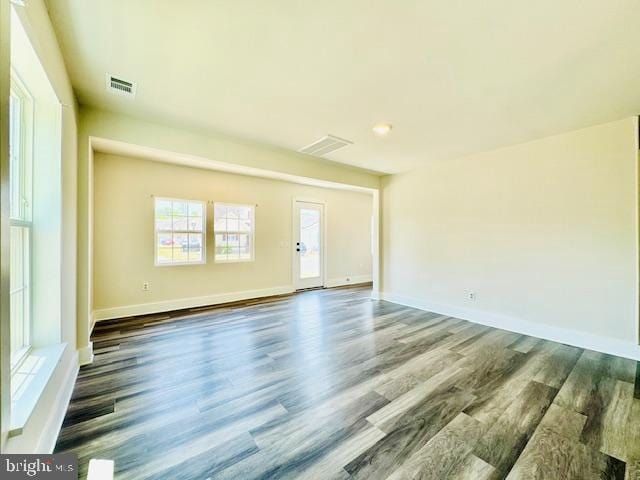 unfurnished room featuring dark hardwood / wood-style floors