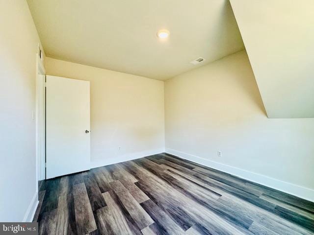 empty room with dark wood-type flooring