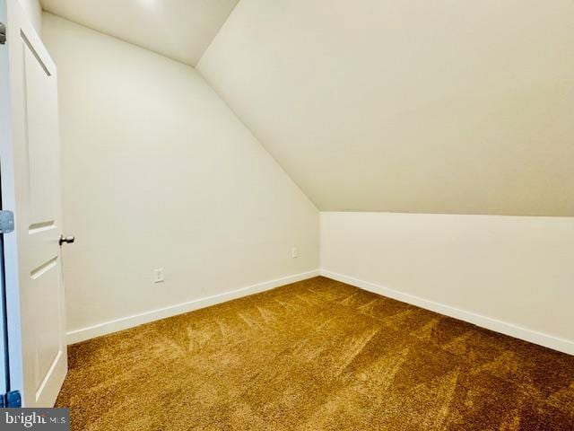 bonus room featuring carpet floors and lofted ceiling