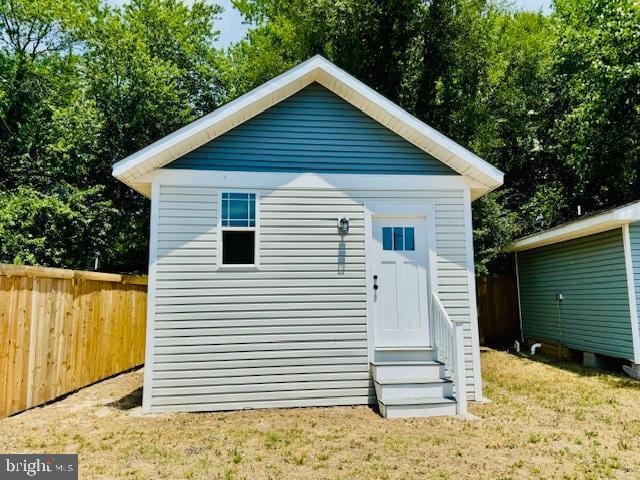 view of outbuilding featuring a yard