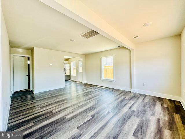 unfurnished room featuring dark hardwood / wood-style floors