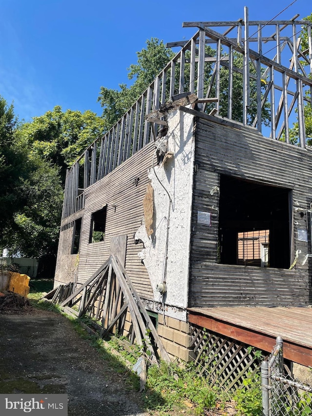 view of property exterior featuring a deck