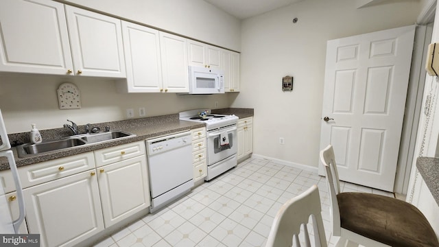 kitchen featuring white cabinetry, white appliances, and sink