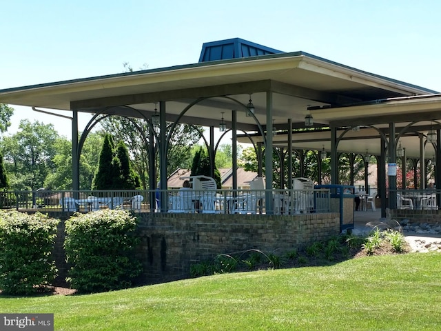 view of home's community featuring a lawn