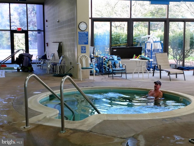 view of pool featuring an indoor hot tub